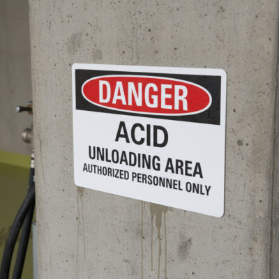 Danger Acid unloading area authorized personnel only